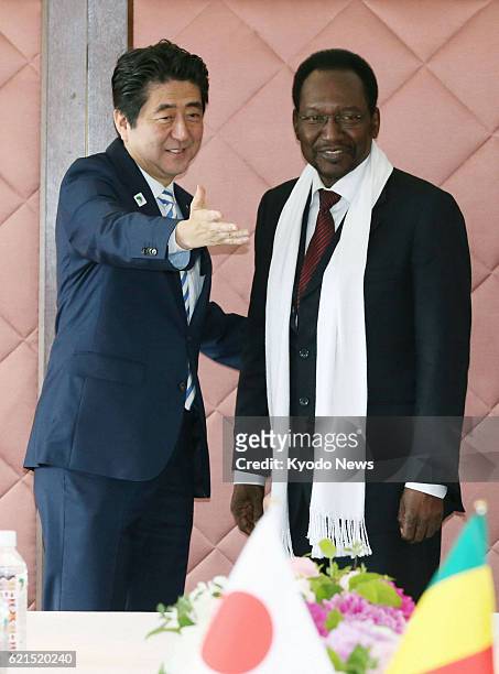 Japan - Dioncounda Traore , Mali's interim president, is escorted by Japanese Prime Minister Shinzo Abe before their meeting in Yokohama, near Tokyo,...