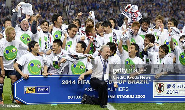 Japan - Japan coach Alberto Zaccheroni and players celebrate after drawing 1-1 with Australia in a World Cup soccer qualifier at Saitama Stadium in...