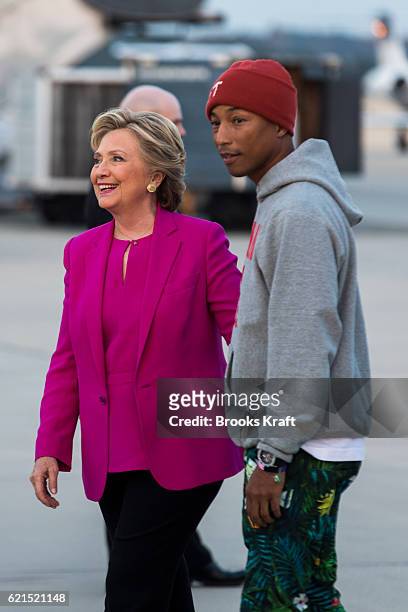 Democratic Presidential candidate Hillary Clinton with rapper Pharrell Williams at Greenville Airport, November 3, 2016 in Greenville, NC. .