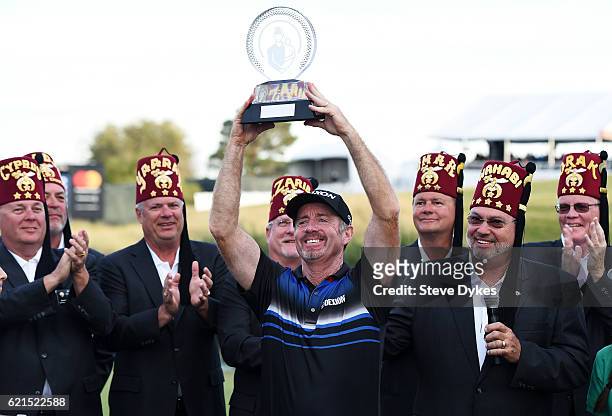 Rod Pampling of Australia celebrates with the winner's trophy after the final round of the Shriners Hospitals For Children Open on November 6, 2016...