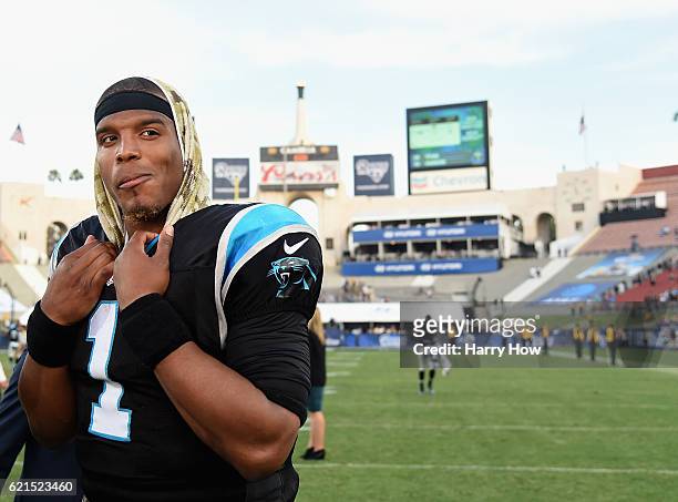 Quarterback Cam Newton of the Carolina Panthers smiles as he is interviewed after his team defeated the Los Angeles Rams 13-10 in the game at the Los...