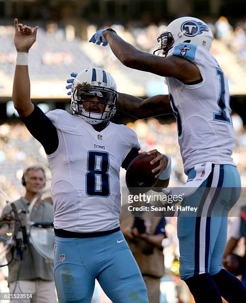Marcus Mariota and Tajae Sharpe of the Tennessee Titans react after Mariota scored a touchdown against the San Diego Chargers in the second half at...