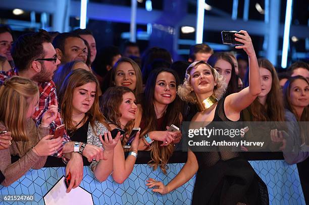 Singer Anne-Marie poses with fans as she attends the MTV Europe Music Awards 2016 on November 6, 2016 in Rotterdam, Netherlands.