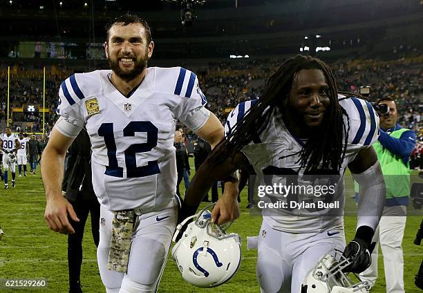 Andrew Luck and Erik Walden of the Indianapolis Colts jog off the field after beating the Green Bay Packers 31-26 at Lambeau Field on November 6,...