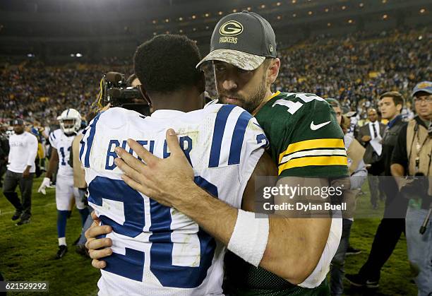 Darius Butler of the Indianapolis Colts and Aaron Rodgers of the Green Bay Packers meet after the Indianapolis Colts beat the Green Bay Packers 31-26...