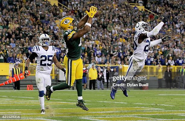 Randall Cobb of the Green Bay Packers scores a touchdown between Patrick Robinson and Darius Butler of the Indianapolis Colts in the fourth quarter...
