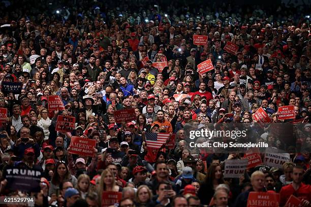 Supporters listen to Republican presidential nominee Donald Trump during a campaign rally at the Freedom Hill Amphitheater November 6, 2016 in...