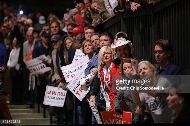 Suppoters listen to Republican presidential nominee Donald Trump during a campaign rally at the Freedom Hill Amphitheater November 6, 2016 in...