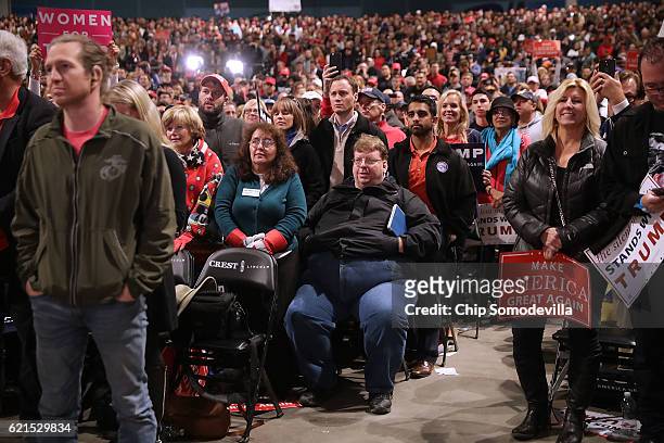 Suppoters listen to Republican presidential nominee Donald Trump during a campaign rally at the Freedom Hill Amphitheater November 6, 2016 in...