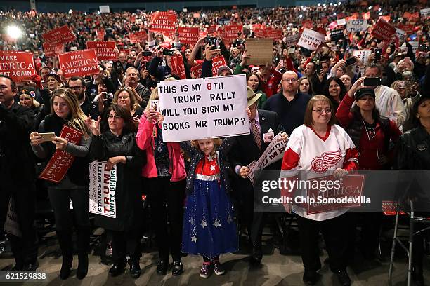 Supporters listen to Republican presidential nominee Donald Trump during a campaign rally at the Freedom Hill Amphitheater November 6, 2016 in...