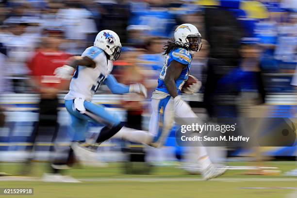 Melvin Gordon of the San Diego Chargers eludes Jason McCourty of the Tennessee Titans on a 35 yard pass play during the second half of a game at...