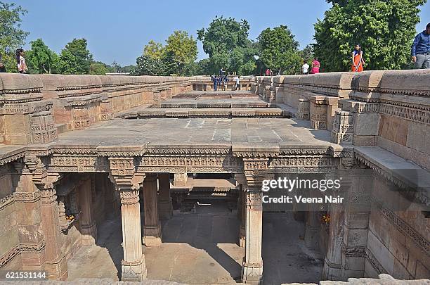 intricate stone/rock carvings-adalaj stepwell-ahmedabad - adalaj stepwell stock pictures, royalty-free photos & images