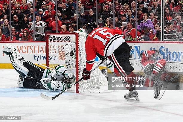 Artem Anisimov of the Chicago Blackhawks scores on goalie Kari Lehtonen of the Dallas Stars in the third period at the United Center on November 6,...