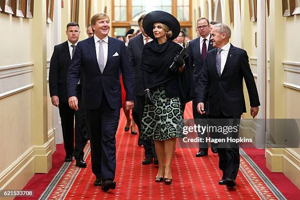 King Willem-Alexander and Queen Maxima of the Netherlands walk with Speaker of the House David Carter before a meeting with Prime Minister John Key...