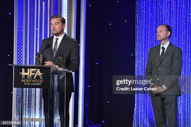 Actor Leonardo DiCaprio and director Fisher Stevens accept the Hollywood Documentary Award for "Before the Flood" onstage during the 20th Annual...