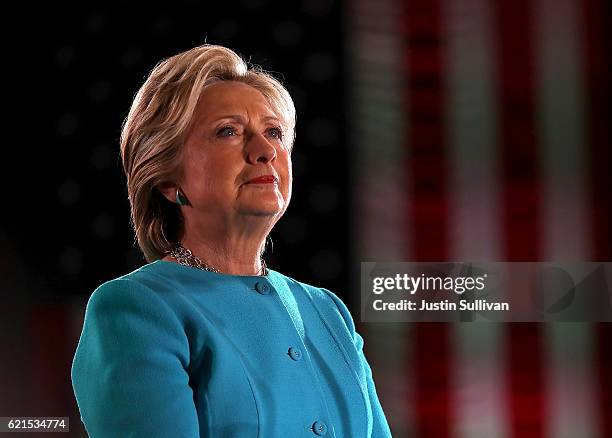 Democratic presidential nominee former Secretary of State Hillary Clinton looks on during a campaign rally at The Armory on November 6, 2016 in...