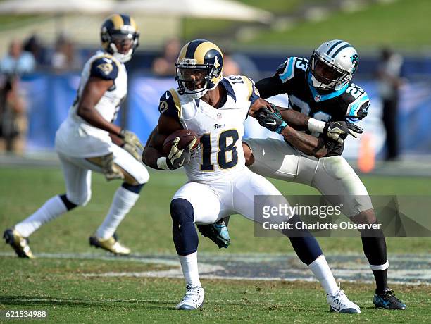 Los Angeles Rams wide receiver Kenny Britt shoves off Carolina Panthers defensive back Leonard Johnson in the first half on Sunday, Nov. 6, 2016 at...
