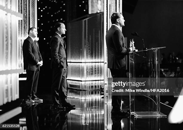 Actor Leonardo DiCaprio and director Fisher Stevens accept the Hollywood Documentary Award for "Before the Flood" from actor Jonah Hill onstage...