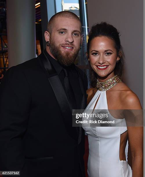 Brantley Gilbert and Amber Cochran attend the 50th annual CMA Awards at the Bridgestone Arena on November 2, 2016 in Nashville, Tennessee.