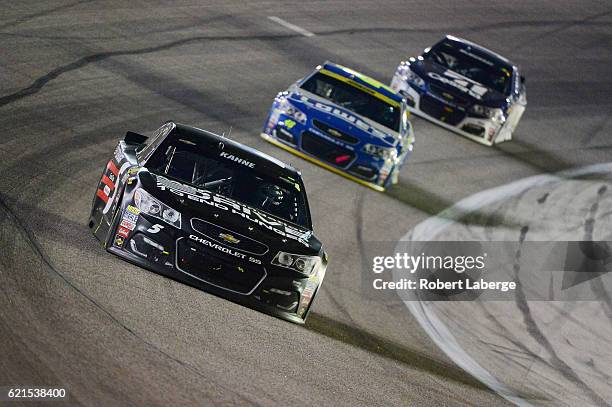 Kasey Kahne, driver of the AARP Drive to End Hunger Chevrolet, leads a pack of cars during the NASCAR Sprint Cup Series AAA Texas 500 at Texas Motor...