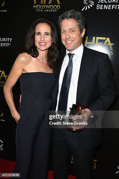 Actors Andie MacDowell and Hugh Grant, recipient of the "Hollywood Supporting Actor Award" for "Florence Foster Jenkins", pose in the press room at...