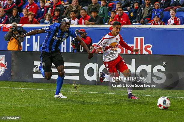 New York Red Bulls midfielder Gonzalo Veron battles Montreal Impact defender Hassoun Camara during the first half of leg 2 of the Eastern Conference...