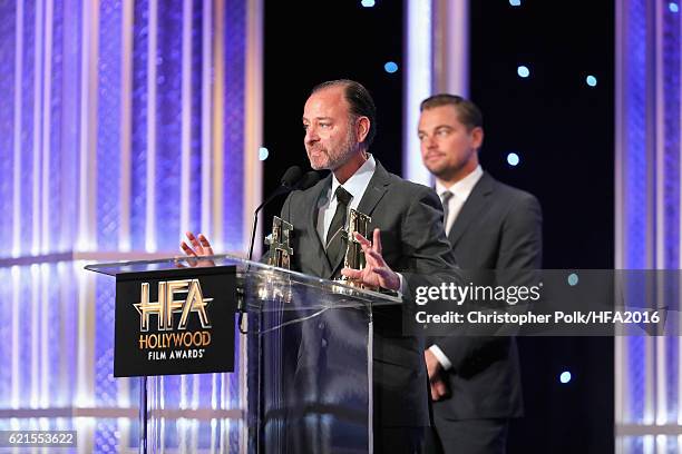 Director Fisher Stevens and producer Leonardo DiCaprio, recipients of the "Hollywood Documentary Award" for "Before The Flood", speak onstage at the...