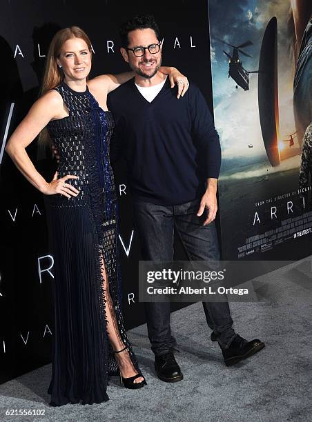 Actress Amy Adams and director J.J. Abrams arrive for the premiere of Paramount Pictures' "Arrival" held at Regency Village Theatre on November 6,...