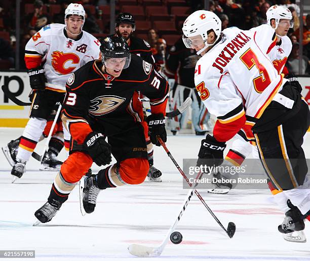 Jakob Silfverberg of the Anaheim Ducks skates with the puck against Jyrki Jokipakka of the Calgary Flames on November 6, 2016 at Honda Center in...