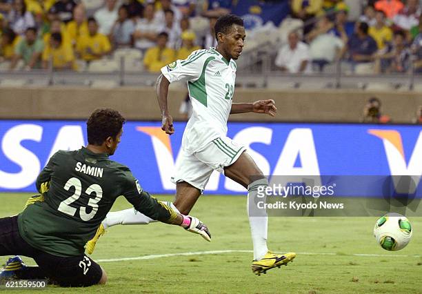 Brazil - Nigeria's Nnamdi Oduamadi scores a hat-trick past Tahiti goalkeeper Xavier Samin during the second half of a Confederations Cup Group B...