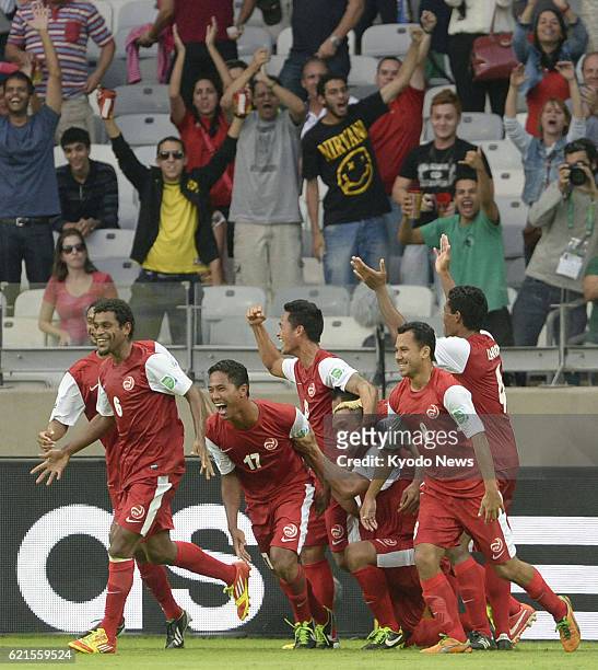 Brazil - Tahiti's Jonathan Tehau celebrates with teammates after scoring a goal during the second half of a Confederations Cup Group B match against...