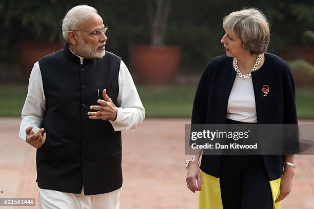 British Prime Minister Theresa May and Indian Prime Minister Narendra Modi walk through the gardens of Hyderabad House, on November 7, 2016 in New...