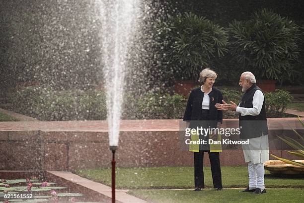 British Prime Minister Theresa May and Indian Prime Minister Narendra Modi walk through the gardens of Hyderabad House, on November 7, 2016 in New...