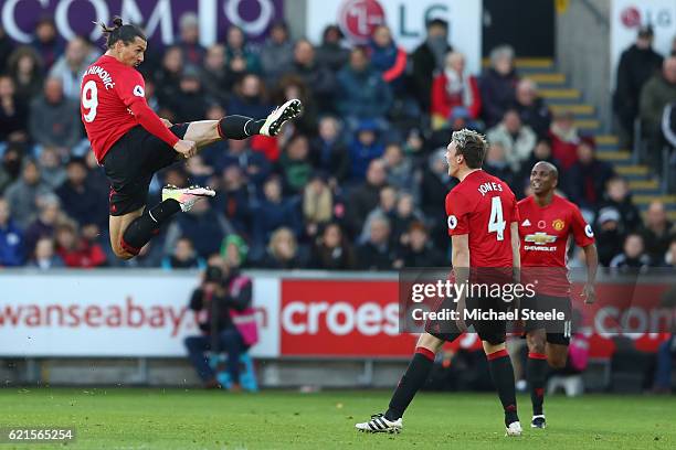 Zlatan Ibrahimovic of Manchester United celebrates towards Phil Jones after scoring his sides second goal during the Premier League match between...