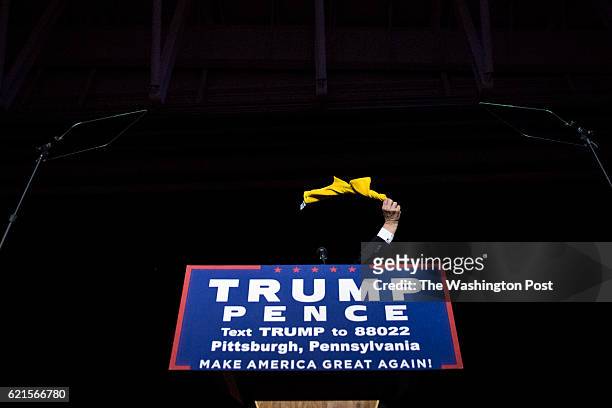 Republican presidential candidate Donald Trump waves around a towel and throws it to the crowd before speaking during a campaign event at an Atlantic...