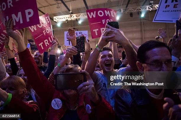 Supporters cheer as Republican presidential candidate Donald Trump speaks during a campaign event at an Atlantic Aviation hanger in Moon Township, PA...