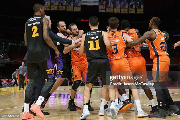 Aleks Maric of the Kings holds Mark Worthington of the Taipans during the round five NBL match between the Sydney Kings and the Cairns Taipans at...