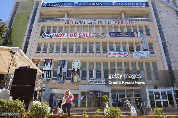 Greece - Photo shows banners including one reading "NOT FOR SALE" on the building of Greek state broadcaster ERT near Athens, Greece, on June 18,...