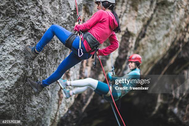 moving down on the cliff - rappelling stock pictures, royalty-free photos & images