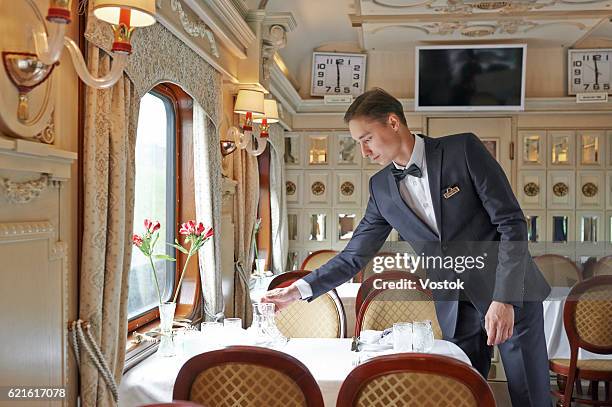 the waiter in the luxury trans siberian express train - transsibirische eisenbahn stock-fotos und bilder