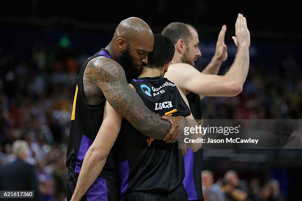 Kevin Lisch of the Kings is congratulated by Josh Powell during the round five NBL match between the Sydney Kings and the Cairns Taipans at Qudos...