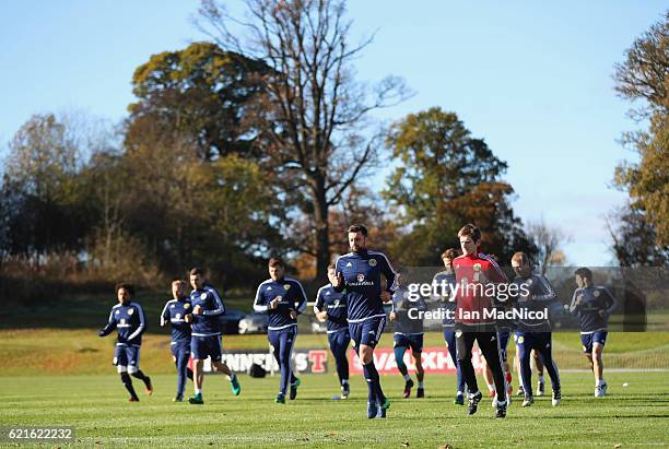 Russell Martin jogs with team mates during a Scotland training session at Mar Hall on November 7, 2016 in Glasgow, Scotland. Scotland are due to face...