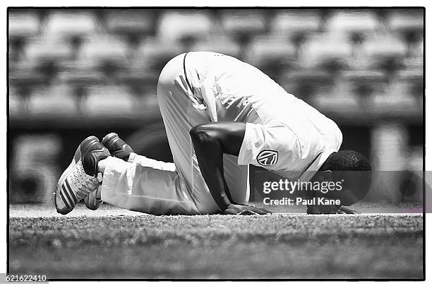 Kagiso Rabada of South Africa kisses the pitch after taking his fifth wicket of the innings during day five of the First Test match between Australia...