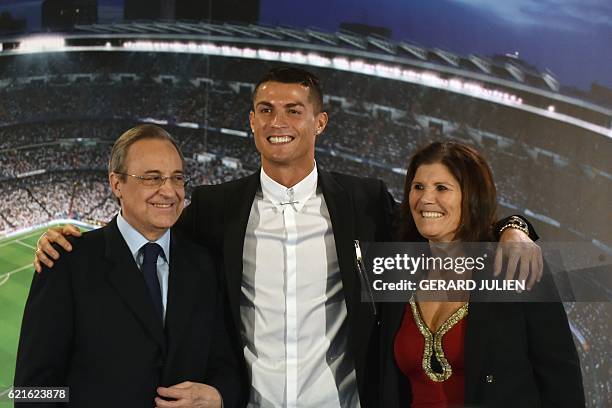 Real Madrid's Portuguese forward Cristiano Ronaldo club president Florentino Perez and Portugal's forward Cristiano Ronaldo's mother Maria Dolores...