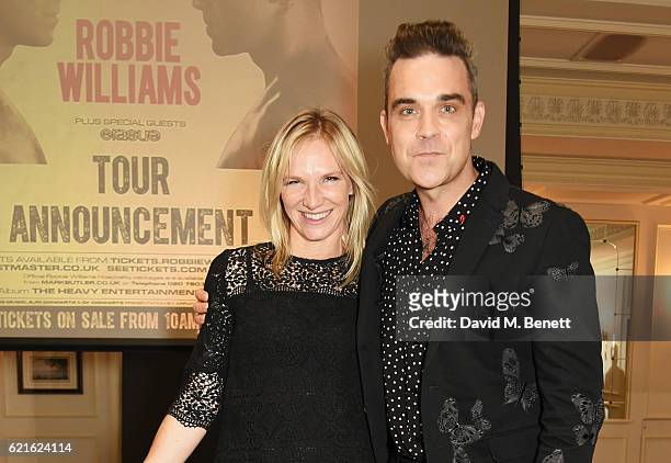 Robbie Williams poses with Jo Whiley as he announces his new album "The Heavy Entertainment Show" and new tour "The Heavy Entertainment Tour"...