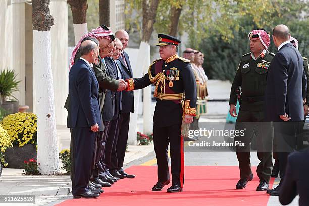 Jordan's King Abdullah II is welcomed by the chairman of the joint chiefs staff Mahmoud Freihat, upon his arrival for the State opening of the...