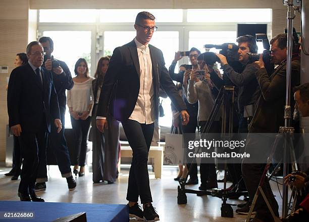 Cristiano Ronaldo of Real Madrid arrives for his press conference after signing a new five-year contract with the Spanish club at the Santiago...