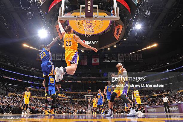 Timofey Mozgov of the Los Angeles Lakers dunks the ball against the Golden State Warriors on November 4, 2016 at STAPLES Center in Los Angeles,...