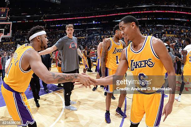 Angelo Russell and Jordan Clarkson of the Los Angeles Lakers shake hands during warm ups before the game against the Golden State Warriors on...