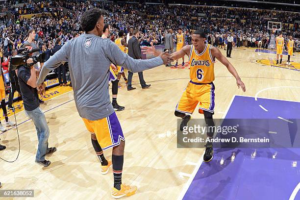 Nick Young and Jordan Clarkson of the Los Angeles Lakers shake hands during warm ups before the game against the Golden State Warriors on November 4,...